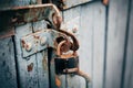 A rusty old lock on a wooden door Royalty Free Stock Photo