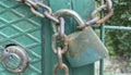 Rusty and old locked metal door. padlock and chain Royalty Free Stock Photo