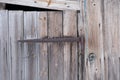 rusty old metal door hinge. Wooden barn door textured background with rusting metal hinge Royalty Free Stock Photo