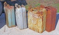 Rusty old metal gasoline cans with peeling paint Royalty Free Stock Photo