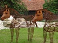 Rusty and old metallic horse statues in the garden