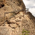 Rusty Old Railings Curve Around Narrow Rock Stairs Royalty Free Stock Photo