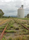 Rusty old railway tracks and wheat silo Royalty Free Stock Photo