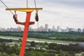 Rusty old red yellow ski lift against the backdrop of the Moscow city. With copyspace Royalty Free Stock Photo