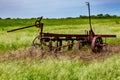 Rusty Old Texas Metal Farm Equipment in Field Royalty Free Stock Photo