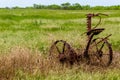 Rusty Old Texas Metal Farm Equipment in Field Royalty Free Stock Photo