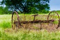 Rusty Old Texas Metal Farm Equipment in Field Royalty Free Stock Photo