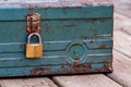 Rusty old toolbox locked up sitting on a wood Royalty Free Stock Photo