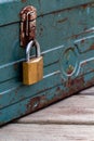 Rusty old toolbox locked up sitting on a wood Royalty Free Stock Photo