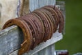 Rusty Old Used Horseshoes on Fence Royalty Free Stock Photo