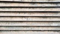 Rusty old ventilation grill on the wall close-up. Old grunge background Royalty Free Stock Photo