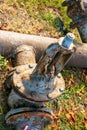 Rusty old water faucet on the background and tubes of water supply Royalty Free Stock Photo