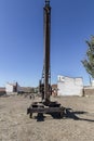 Rusty old winch crane used in a stone quarry