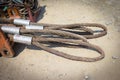 Rusty old wire rope on the ground Royalty Free Stock Photo