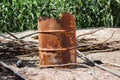 Rusty orange metal barrel, old barrel and damaged