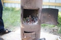 Rusty oven for cooking Uzbek pilaf, heated by burning wood