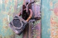 Rusty padlock locks the old gate of an abandoned hangar Royalty Free Stock Photo