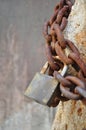 Rusty padlock and metal chain