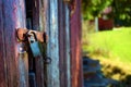 Rusty padlock on an old wooden door Royalty Free Stock Photo