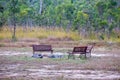 Rusty park benches around a firepit on the Atherton Tableland in