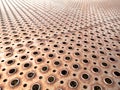 Rusty perforated metal sheet floor