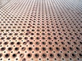 Rusty perforated metal sheet floor