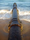 Rusty pipe on beach