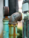 Rusty pipes of water pump Out door, After many years of operation corroded metal pipe was destroyed Royalty Free Stock Photo