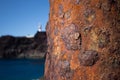 Rusty pole at coastline ocean background , rust / rusted metal