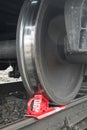 Rusty and polished freight trains wheel on railroad track. Royalty Free Stock Photo