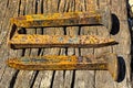 Rusty railroad spikes laying on ground in a pile Royalty Free Stock Photo