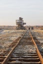 Rusty railroad tie. Giant stacker. Bucket chain excavator in a sand quarry. Bulk material handling