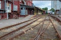 Rusty rails going through an abandoned industrial zone