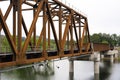 Rusty railway bridge over the Washugal river in Washington Royalty Free Stock Photo