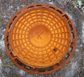 Rusty red sewer hatch