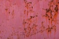 rusty red sun faded paint on flat sheet metal surface full-frame background and texture Royalty Free Stock Photo