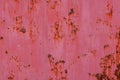 rusty red sun faded paint on flat sheet metal surface full-frame background and texture Royalty Free Stock Photo