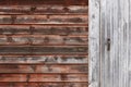 Rusty red wooden home facade detail. Closed door