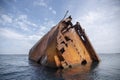 The rusty remains of a sunken ship