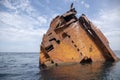 The rusty remains of a sunken ship