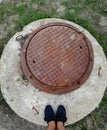 Rusty round sewerage hatchway
