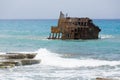 Rusty ruined ship wreck remainings in the middle of the sea, close to the shore of Cyprus.