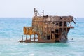 Rusty ruined ship wreck remainings in the middle of the sea, close to the shore of Cyprus.