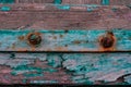 Rusty screws and hinge on an old door Royalty Free Stock Photo