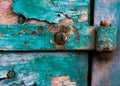 Rusty screws and hinge on an old door Royalty Free Stock Photo