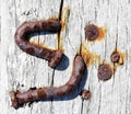 Rusty screws on old wall