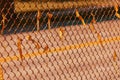 Rusty section of a rusty chain link fence with ribbons on it Royalty Free Stock Photo