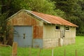 Rusty shed on concrete base Royalty Free Stock Photo