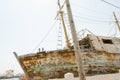 Rusty ship in the port on the beach