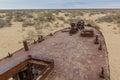 Rusty ship at the ship graveyard in former Aral sea port town Moynaq Mo ynoq or Muynak , Uzbekist Royalty Free Stock Photo